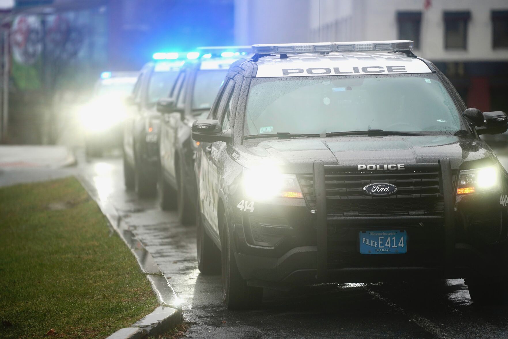 Police cars lined up with lights on